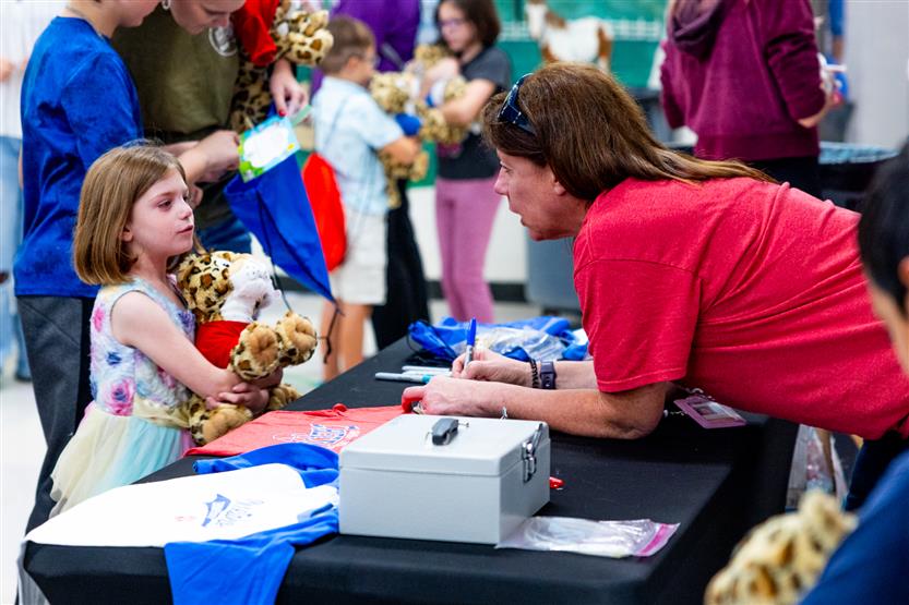 Students build a cheetah at a community event